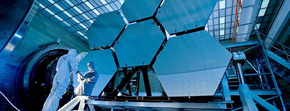 Scientists working on a big beehive-shaped model